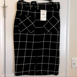 Zara Black & white plaid midi skirt with front slit and belt.